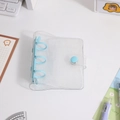 Detail of 3-ring mini binder with blue glitter PVC cover and snap closure for journals - Transparent Glitter Cover / Blue