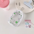 Detail view of transparent PVC pouch with green clover patterns and silver metal buckle - Green Clover