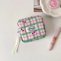 Close-up of cherry pattern plaid storage bag with Hisocute label and ribbon zipper detail - Green