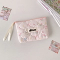 Detailed view of pink quilted storage bag with cute bear and floral patterns and silk zipper - Pink
