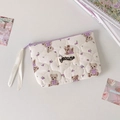 Detailed close-up of quilted cotton mini pouch with teddy bear and floral print pattern - Purple