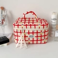 Close-up of a red checkered cherry makeup bag with ribbon zippers and soft handle - Rose Red