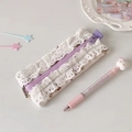 Detail of floral lace stationery pouch featuring purple zipper and ruffled edges - Purple