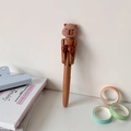 Close-up of creative boxing pen featuring a cute brown bear with movable red gloves - Brown Bear
