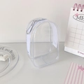 Detailed close-up of transparent PVC storage bag with white zipper and silver metal hook - White