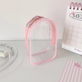 Macro shot of a mini clear PVC doll display backpack with pink trim and metal clip - Pink