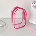 Close-up of a clear PVC doll display bag with vibrant pink zipper and silver metal hook - Rose Red