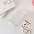 Close-up of a clear acrylic storage box showcasing items on a clean minimalist desk - Transparent Rectangular - Without Pendant