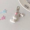 Close-up of white plush puppy keychain with heart charm and bone pendant on a plate - Bone Puppy Pendant (Hook Version)