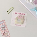 Close-up of pink gradient acrylic house photo card holder with green metal bead chain - Pink Yellow Rabbit