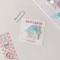 Close-up of cute house-shaped acrylic photocard holder with heart cutout and dolphin pattern - Blue Dolphin