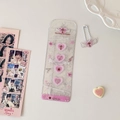 Close-up of glitter PVC photo sleeve with pink hearts and angel wing keychain charm - Pink