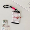 Detail of sliding card holder with cute puppy print, lanyard and acrylic pendant charm - White Dog UI Style / Black