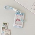 Light blue sliding ID card holder with dolphin pendant and woven lanyard detail - Dolphin Charm Style / Blue