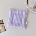 Detailed view of lavender quilted fabric coaster with soft vertical stripes and woven label - Purple Striped