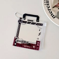 Close-up of transparent PVC mini bag with black handles and metal bead chain detail - Black Red