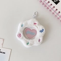 Close-up of white plush flower bag for 58mm anime badges with clear window and hook - White Fish Cake (Flower Style)