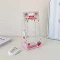 Macro view of transparent PVC doll storage bag with pink strawberry prints and handle - Pink Strawberry