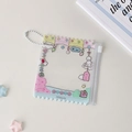 Close-up of pink PVC anime candy bag photocard holder with cute cloud and star illustrations - Doll Wind Chime