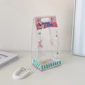 Close-up of clear PVC doll storage bag featuring cartoon puppy art and pink handle details - Pink Dog