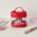 Detail of red PVC cartoon makeup bag with double zippers and cupcake illustration - Red