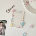 Close-up of clear acrylic photo card holder with colorful stars and star metal keychain - Pink and Blue Stars