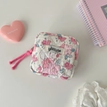 Detail of quilted floral storage pouch with pink zipper and delicate hisocute label - White Flower
