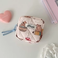 Detailed view of pink quilted fabric organizer bag with cute capybara pattern and zipper - Khaki Capybara