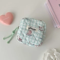 Close-up of mint green quilted pouch with cute cartoon rabbit and rocking horse patterns - Green Rabbit