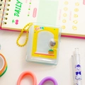 Close-up of mini transparent PVC photo album with cute yellow ball chain and decorative insert - Yellow-Yellow Window