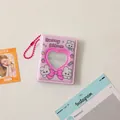Macro shot of pink bunny photocard album with heart cutout and beaded chain strap - Bowtie Bunny