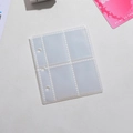 Detalle de fundas de PVC transparente con 4 compartimentos y 3 orificios para tarjetas de fotos - Transparente (4 Bolsillos / 10 Hojas)