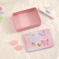 Close-up of pink tin storage box with floral patterns and butterfly illustrations - Butterfly Flower Style / Pink