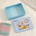 Detailed view of light blue tin storage box with checkered lid and photo card set - Blue