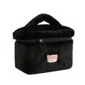 Detail of black plush makeup bag showing soft faux fur texture and dual metal zippers - Black