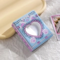 Close-up of cute 3-inch mini photo album with heart-shaped cutout and pastel design - Tiffany Blue