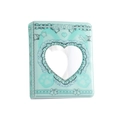 Detail of mint green mini photo album with heart-shaped cutout and lace pattern edges - Green