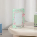 Detail of mint green acrylic photo frame stand with heart and star patterns for kpop cards - Green