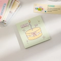 Dettaglio di un blocco note quadrato con illustrazione di dessert e carta verde pastello - Verde