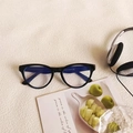 Classic black cat-eye sunglasses featuring anti-blue light lenses with a glossy finish - Black Frame Clear Lenses