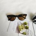 Retro cat-eye sunglasses with black frames and translucent brown lenses in KD08139 C2 variant - Black Frame Tea Lens