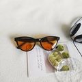 Retro cat-eye sunglasses with black frame and orange lenses for high-fashion street style - Black Frame Orange Lens