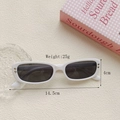 White vintage oval sunglasses with dark lenses and heart accents on a stylish background - Porcelain White