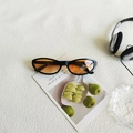 Vintage oval black sunglasses with stylish orange gradient lenses in a trendy aesthetic - Black Frame Gradient Orange