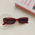Retro red rectangular sunglasses with heart studs on a minimalist lifestyle background - Burgundy