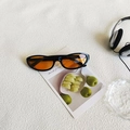 Retro oval sunglasses with black frames and vibrant orange tinted lenses for daily wear - Black Frame Orange Lens