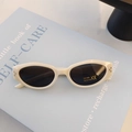 Retro cream white oval kids sunglasses with UV400 protection and metal accents - Off White