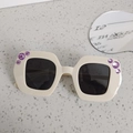Cream-colored square oversized kids sunglasses featuring purple rhinestones and dark lenses - Beige
