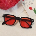 Vintage irregular sunglasses with sleek black frame and translucent red lenses for styling - Retro Square Black Frame Red Lens Style