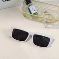 Chic white oval cat eye sunglasses with dark lenses displayed with lifestyle accessories - Vintage Cat Eye Rectangular Style (White 11)